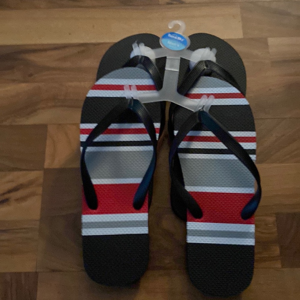 Men’s flip flops 2 pair one black and other multi color brand new never wore